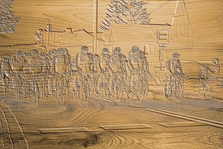 Cycling peloton depicted as a sculpture in wood